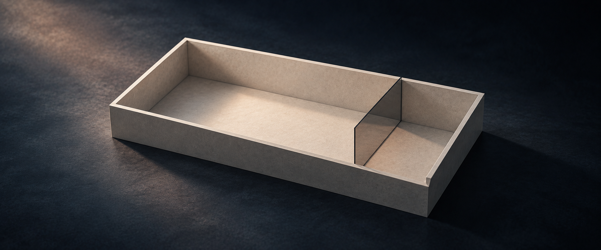 An architectural model divided into a broad main space and a narrow companion space by glass.